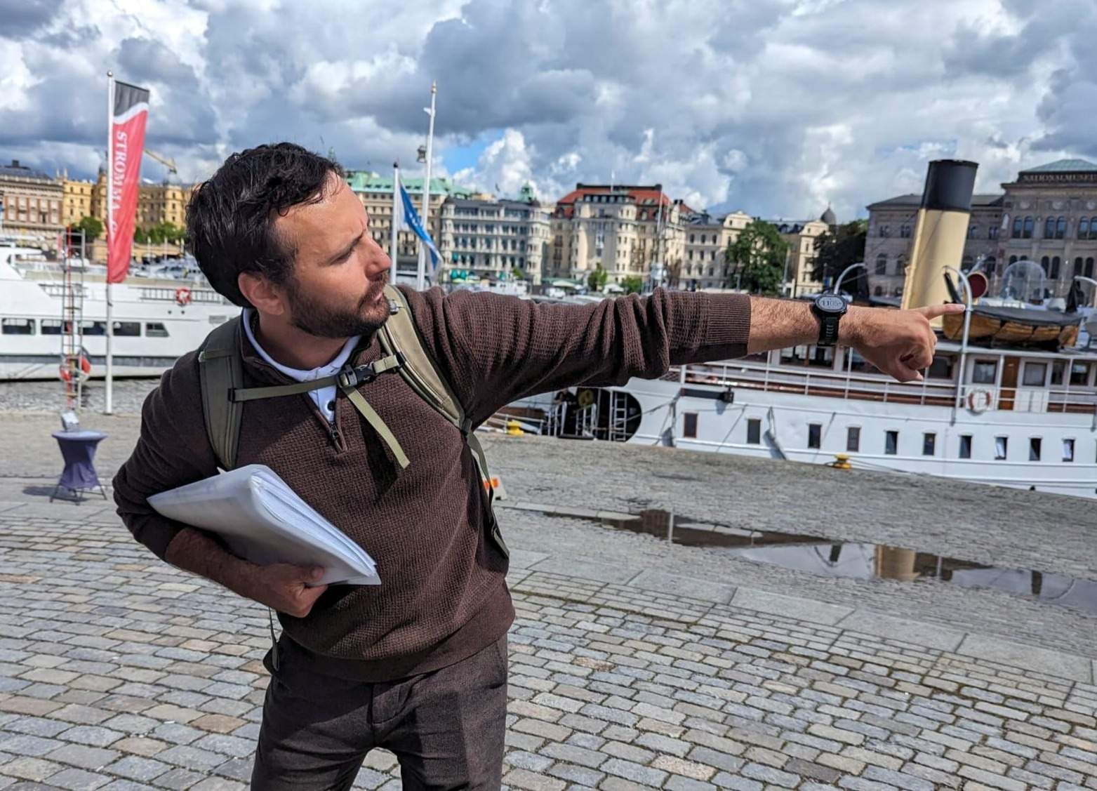 Konstantin guiding a small group through Gamla Stan, Stockholm